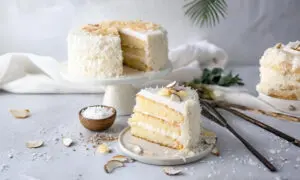 Light and moist coconut cake with fluffy coconut cream frosting.